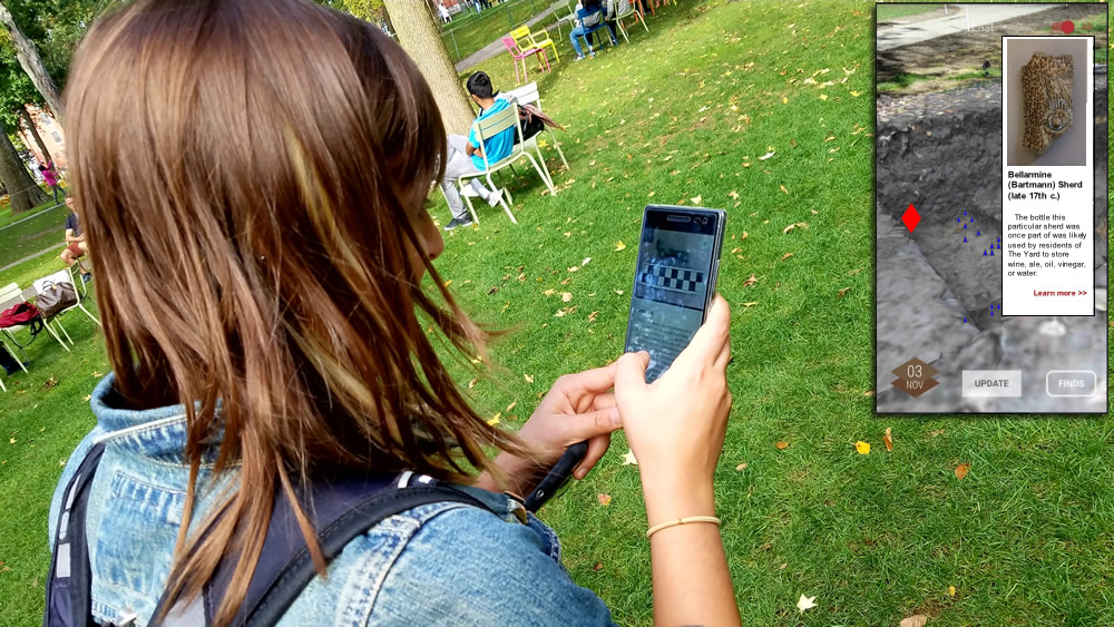 Lexi Hartford, PhD candidate in archaeology and digital teaching fellow for the Archaeology of Harvard Yard course, explores the excavation site using the HYAP AR app